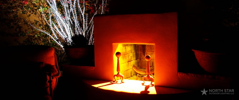 North Star Outdoor Lighting in Scottsdale Arizona showing outdoor fireplace with red lighting