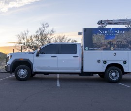 North Star Outdoor Lighting branded service truck parked at dusk